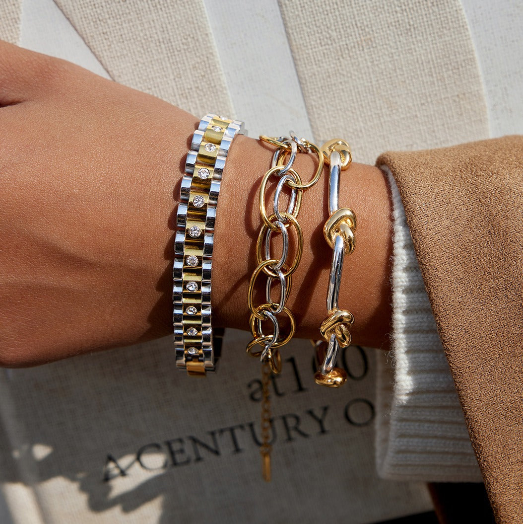 18K gold - plated, lightweight, and luxurious two - tone titanium steel bracelet.