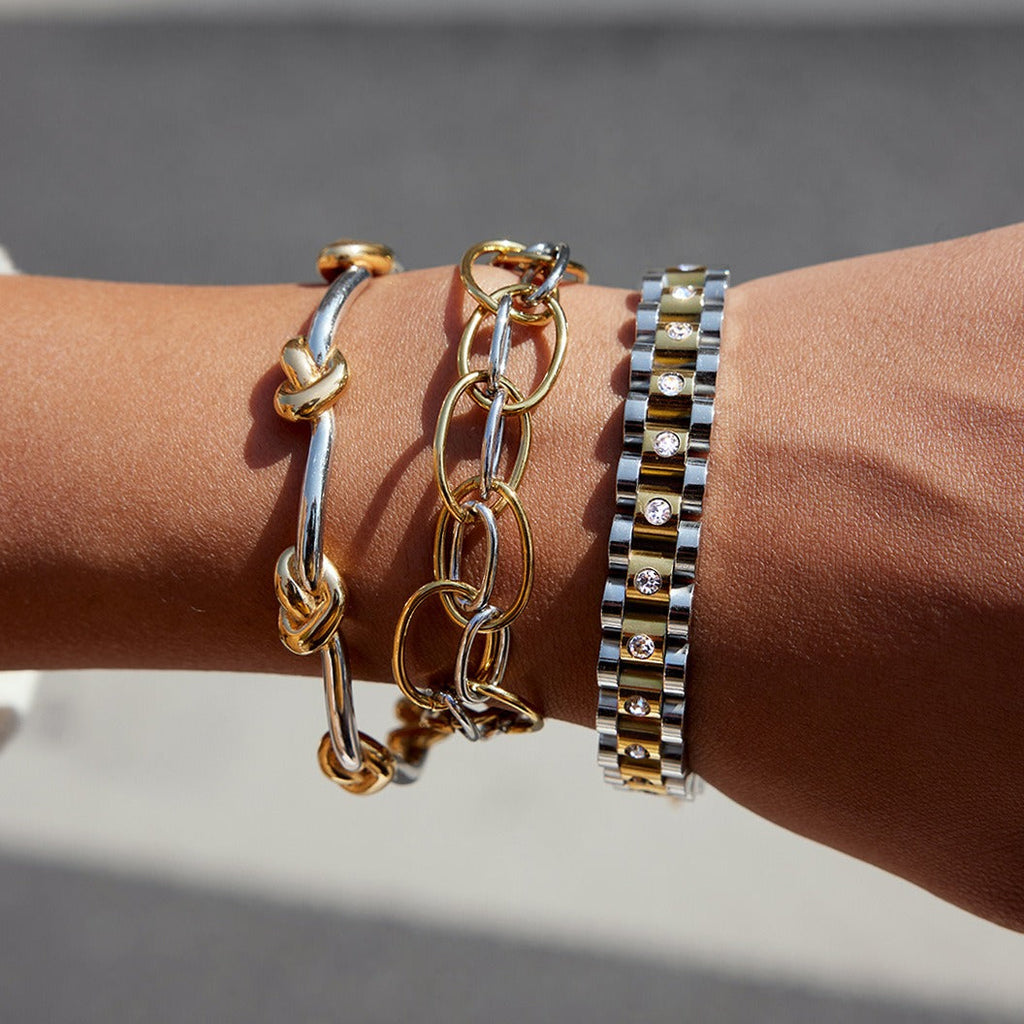 18K gold - plated, lightweight, and luxurious two - tone titanium steel bracelet.