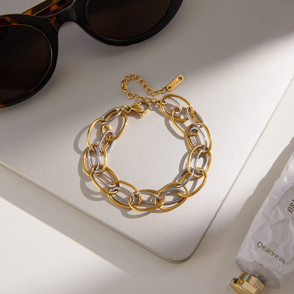 18K gold - plated, lightweight, and luxurious two - tone titanium steel bracelet.